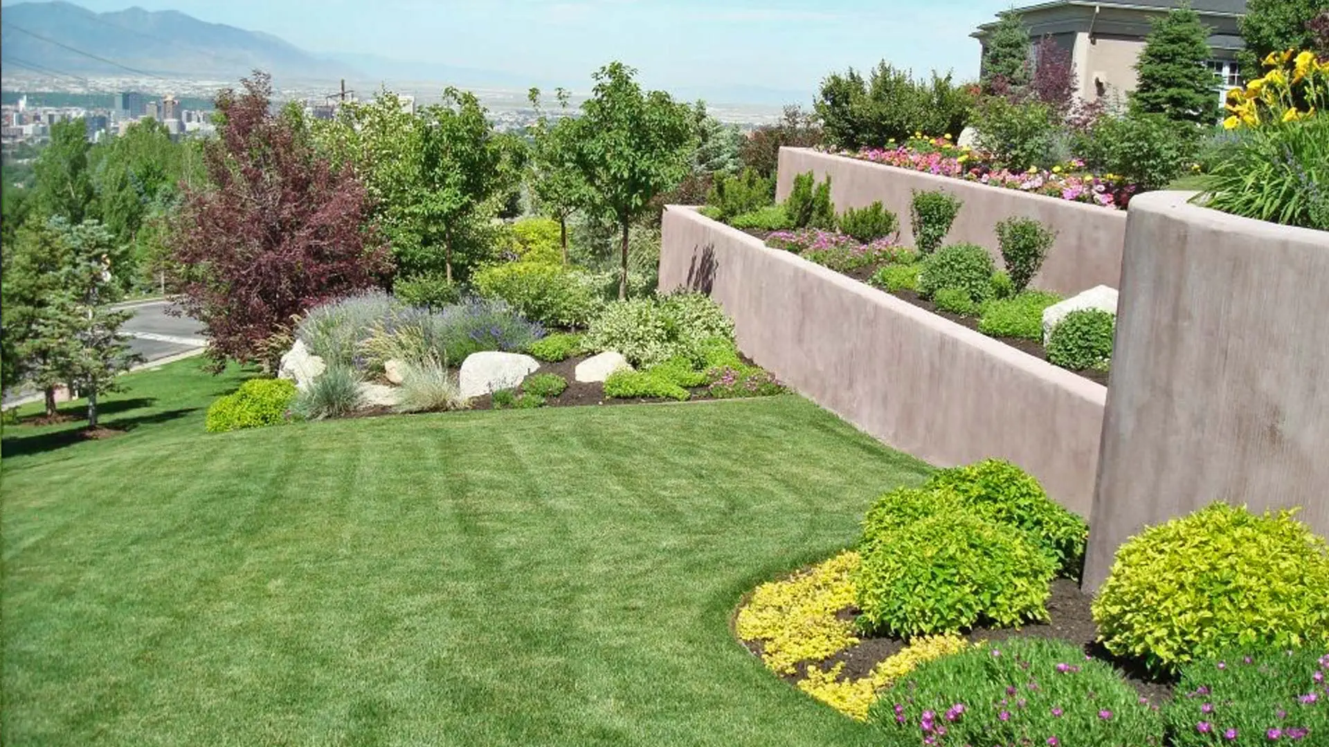Lawn mowing stripes and meticulously maintained landscaping at a property located in Draper. 