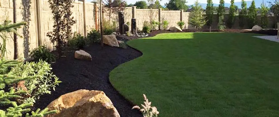 The backyard of a home in Draper that we regularly maintain the lawn and all landscaping beds. 