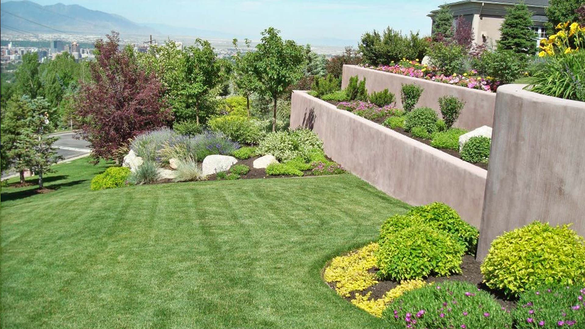 Lawn mowing stripes and meticulously maintained landscaping at a property located in Draper.