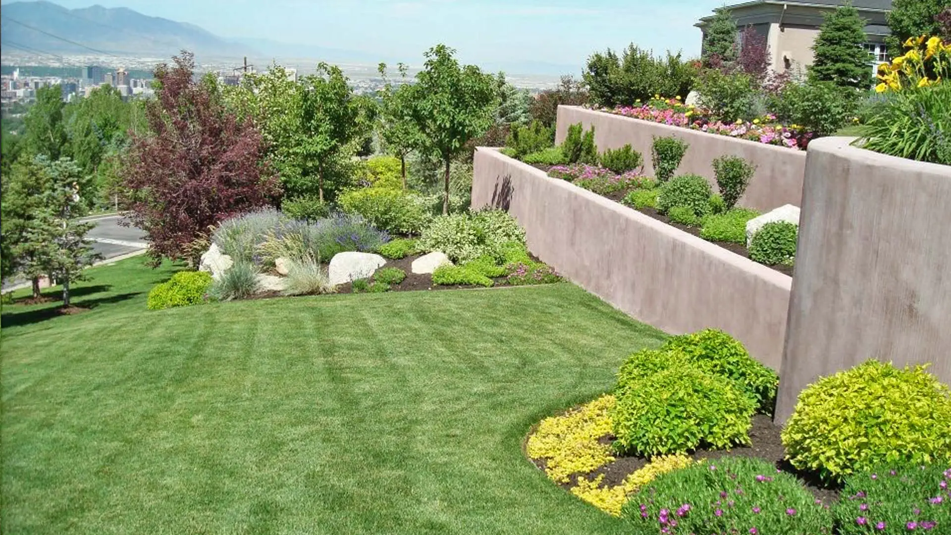 Lawn mowing stripes and meticulously maintained landscaping at a property located in Draper.