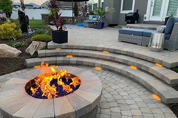 A custom patio and fire pit that our team installed in Draper, UT.