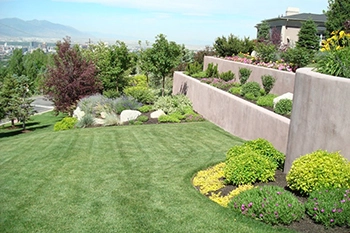 Salt Lake City home with beautiful landscaping that we maintain on a regular basis.